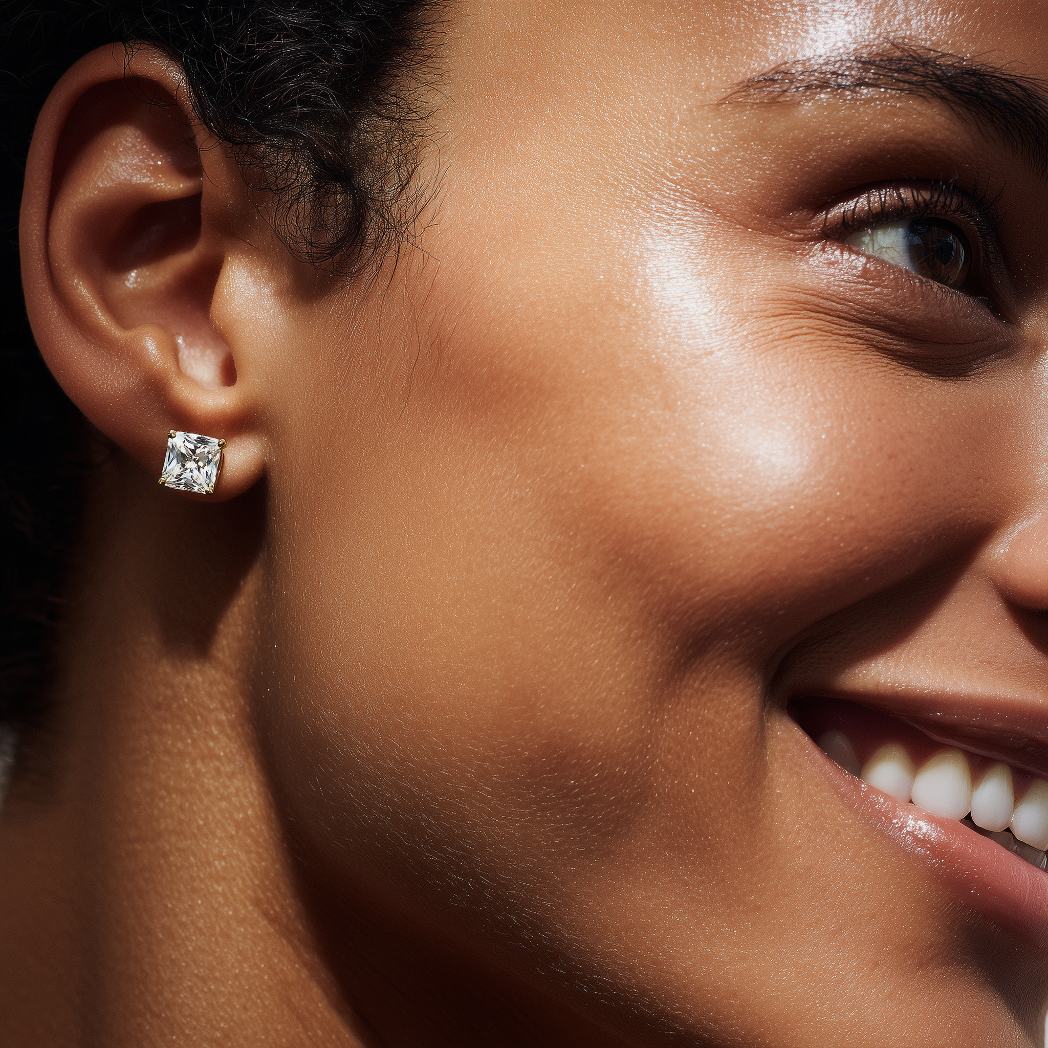 Close-up of a woman wearing a diamond earring with a blurred background